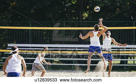 Beach volleyball game View Large Photo Image Stock Image - Beach volleyball game. Fotosearch