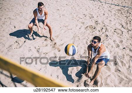 Beach volleyball game View Large Photo Image Stock Photo - Beach volleyball game. Fotosearch