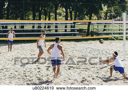Beach volleyball game View Large Photo Image Stock Photo - Beach volleyball game. Fotosearch