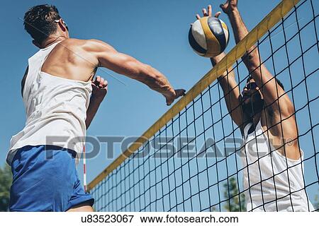 Beach volleyball game View Large Photo Image Stock Photo - Beach volleyball game. Fotosearch