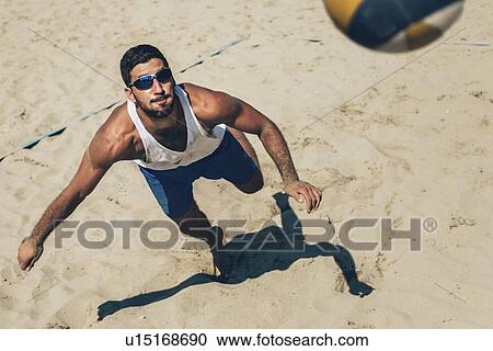 Stock Image - Beach volleyball player. Fotosearch