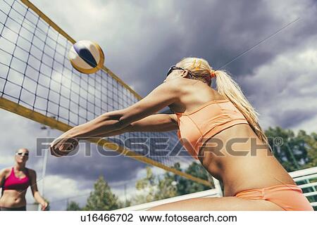 Stock Image - Beach volleyball players. Fotosearch
