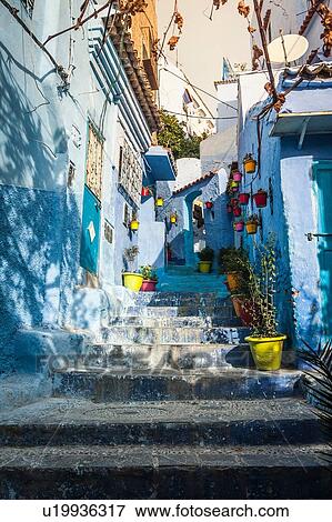 Stock Photo - Blue painted house exteriors on stairway, Chefchaouen, Morocco. Fotosearch