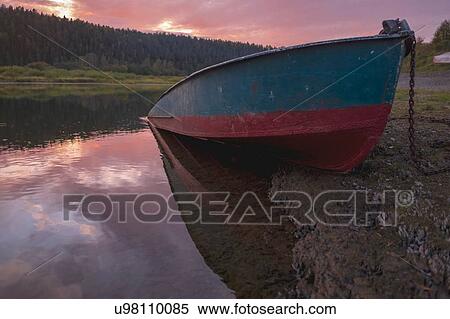 Stock Photography - Boat on river bank, Ural, Sverdlovsk, Russia. Fotosearch