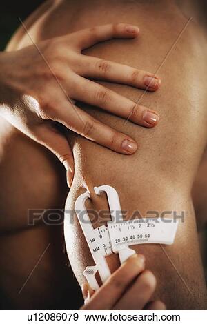 Body fat measurement View Large Photo Image Stock Photo - Body fat measurement. Fotosearch