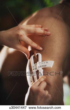 Stock Photo - Body fat measurement. Fotosearch