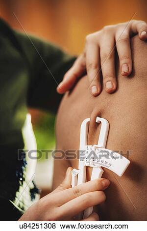 Body fat measurement View Large Photo Image Stock Photo - Body fat measurement. Fotosearch
