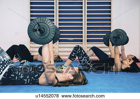 Stock Photo - Body pump fitness class. Fotosearch
