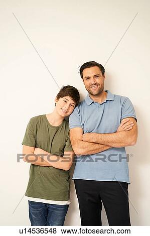 Boy and father with arms folded, portrait View Large Photo Image Stock Photo - Boy and father with arms folded, portrait. Fotosearch