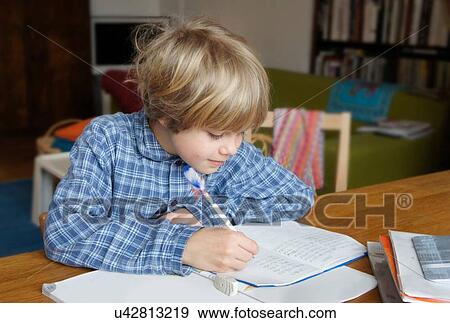 Boy doing homework View Large Photo Image Stock Photo - Boy doing homework. Fotosearch