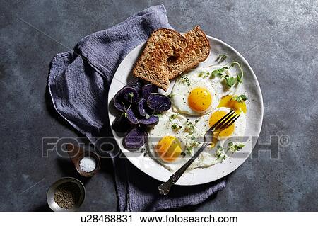 Breakfast plate of eggs and toast, overhead view View Large Photo Image Stock Image - Breakfast plate of eggs and toast, overhead view. Fotosearch
