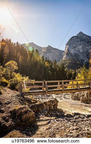 Stock Photograph - Bridge over river, Karwendel region, Hinterriss, Tirol, Austria. Fotosearch