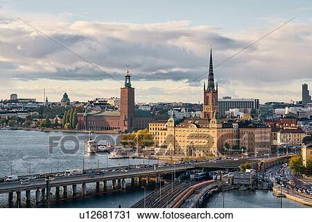 Stock Image - Bridges, railway tracks, church tower, cityscape and water canal, Stockholm, Sweden. Fotosearch