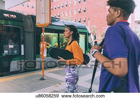 Brother and sister at tram stop, Milan, Italy View Large Photo Image Stock Photo - Brother and sister at tram stop, Milan, Italy. Fotosearch