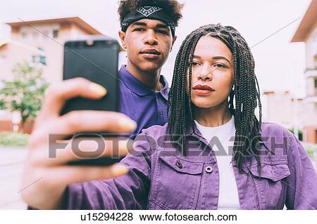 Brother and sister taking selfie View Large Photo Image Stock Photo - Brother and sister taking selfie. Fotosearch