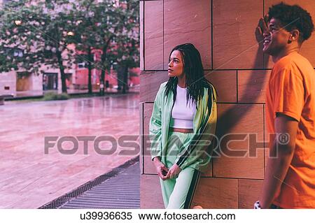 Brother and sister waiting by building, Milan, Italy View Large Photo Image Stock Photography - Brother and sister waiting by building, Milan, Italy. Fotosearch