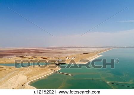 Canal leading water to Dead Sea Works by shore, Dead Sea, Israel. Aerial photography with drone View Large Photo Image Stock Image - Canal leading water to Dead Sea Works by shore, Dead Sea, Israel. Aerial photography with drone. Fotosearch