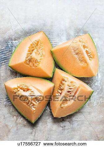 Cantaloupe melon slices View Large Photo Image Stock Photo - Cantaloupe melon slices. Fotosearch