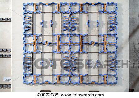 Stock Photography - Cardboard cutter in cardboard box factory. Fotosearch