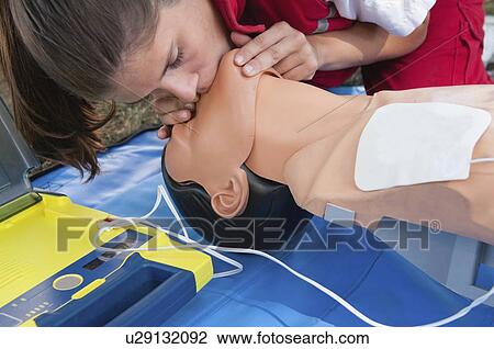 Stock Image - Cardiopulmonary resuscitation on dummy. Fotosearch