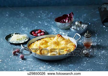Stock Photograph - Cauliflower cheese in skillet, Christmas food. Fotosearch