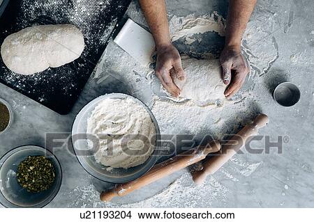 Picture - Chef kneading pastry dough. Fotosearch