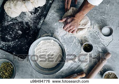Stock Photograph - Chef kneading pastry dough. Fotosearch
