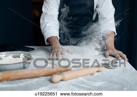 Chef working with pastry dough View Large Photo Image Stock Image - Chef working with pastry dough. Fotosearch