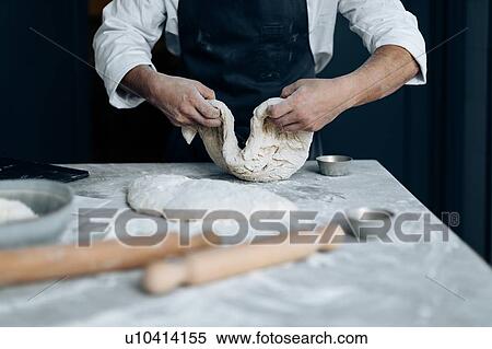 Stock Photography - Chef working with pastry dough. Fotosearch