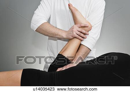 Stock Image - Chiropractic adjustment. Fotosearch