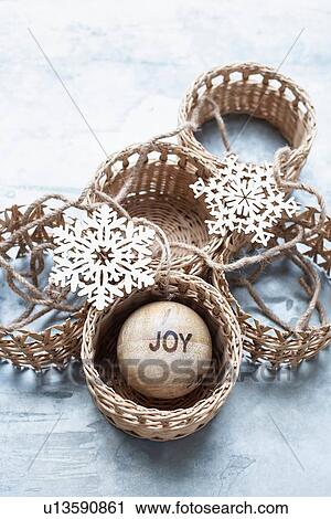 Stock Image - Christmas ornaments and wicker baskets. Fotosearch
