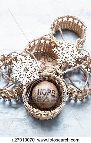 Stock Image - Christmas ornaments and wicker baskets. Fotosearch