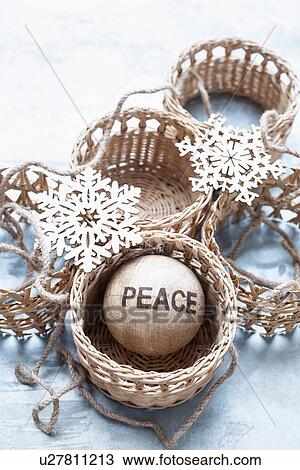 Stock Image - Christmas ornaments and wicker baskets. Fotosearch