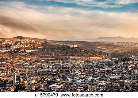 Stock Image - Cityscape and distant mountains, elevated view, Fes, Morocco. Fotosearch