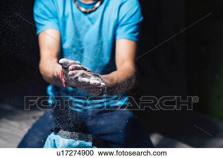 Climber applying chalk on hands View Large Photo Image Stock Image - Climber applying chalk on hands. Fotosearch