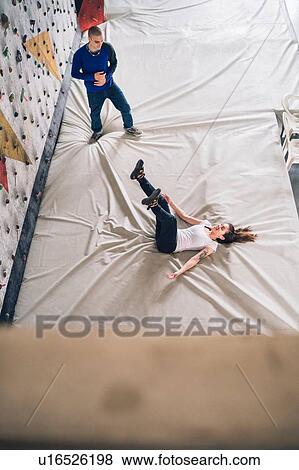 Climber falling on back on crash mat View Large Photo Image Stock Photo - Climber falling on back on crash mat. Fotosearch
