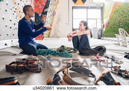 Climber friends on crash pad working with and learning about climbing equipment View Large Photo Image Stock Image - Climber friends on crash pad working with and learning about climbing equipment. Fotosearch