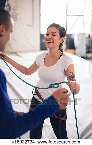 Picture - Climber friends working with climbing ropes. Fotosearch