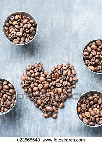 Coffee beans in bowls and heart shape View Large Photo Image Stock Photo - Coffee beans in bowls and heart shape. Fotosearch