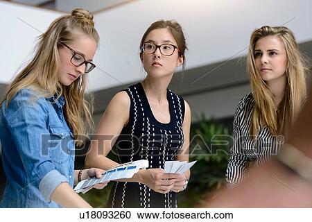 Colleagues brainstorming with colour charts View Large Photo Image Stock Image - Colleagues brainstorming with colour charts. Fotosearch