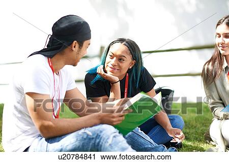 College students reading and talking in campus View Large Photo Image Stock Image - College students reading and talking in campus. Fotosearch