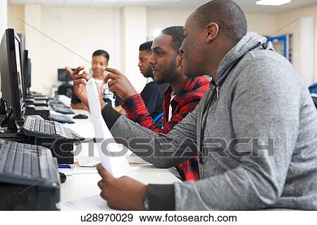 Stock Photo - College students studying with computer in classroom. Fotosearch