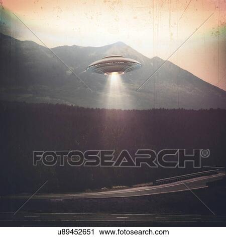Stock Image - Composite image of an unidentified flying object (UFO) illuminating a road.. Fotosearch