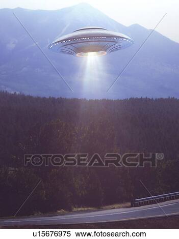Composite image of an unidentified flying object (UFO) illuminating a road. View Large Photo Image Stock Photography - Composite image of an unidentified flying object (UFO) illuminating a road.. Fotosearch