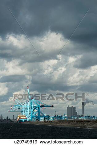 Stock Photo - Container terminal situated on the newest part of Rotterdam harbour, Netherlands. Fotosearch