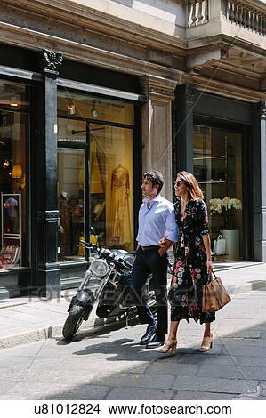 Picture - Couple enjoying leisurely walk, Milan, Italy. Fotosearch