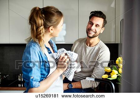 Couple talking in kitchen View Large Photo Image Stock Image - Couple talking in kitchen. Fotosearch