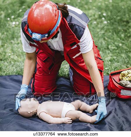 CPR training on baby dummy View Large Photo Image Picture - CPR training on baby dummy. Fotosearch