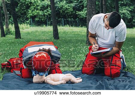 CPR training on baby dummy View Large Photo Image Picture - CPR training on baby dummy. Fotosearch