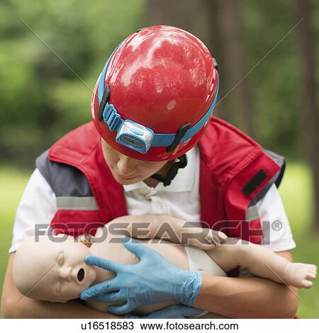 CPR training on baby dummy View Large Photo Image Stock Image - CPR training on baby dummy. Fotosearch